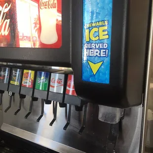 a close up of a soda machine