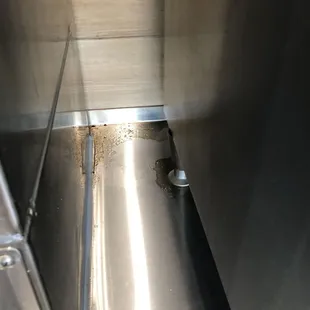 Behind soda machine.