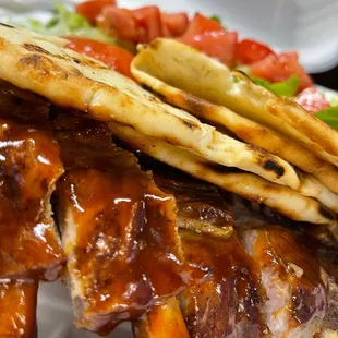a plate of ribs and fries