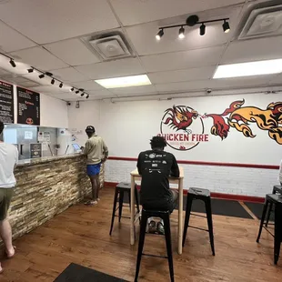 customers at the counter of a restaurant