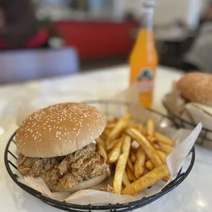two sandwiches and french fries