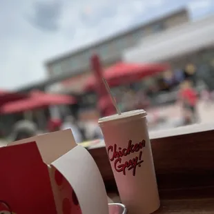 a paper cup of chicken