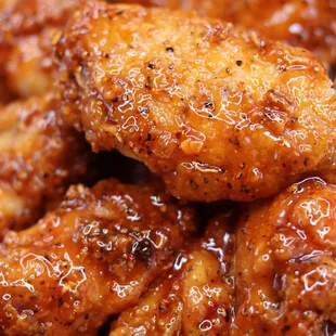 Breaded Jumbo wings drizzled with Scorpion Butter!
