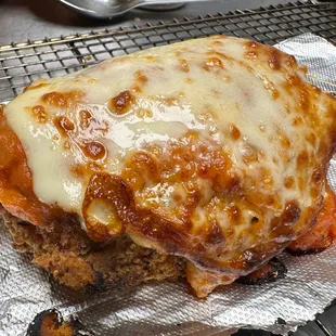 Melty Chicken Head parm covered in marinara and provolone!