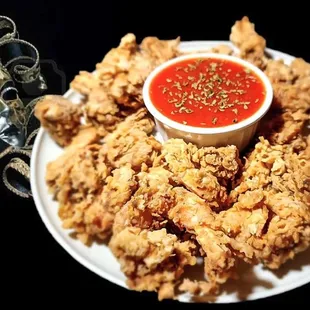a plate of fried chicken and a masquerade mask