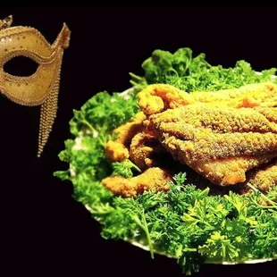 a plate of food and a mask