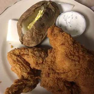 2 piece white dinner with baked potato.