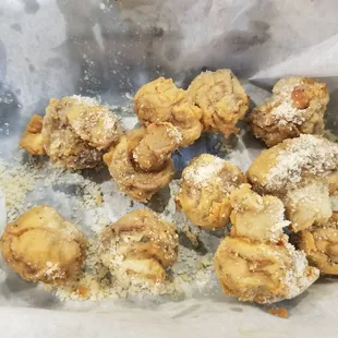 About half the basket of breaded mushrooms we had. They are now a favorite item for us.