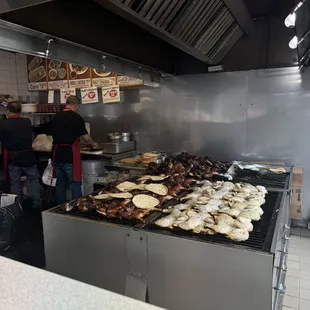 people in the kitchen preparing food