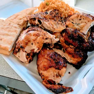 Half Chicken served with rice and pita