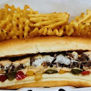 Philly cheesesteak with waffle fries