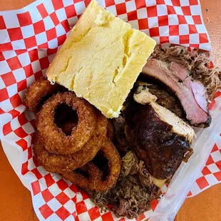 Sampler platter with onion rings and corn bread