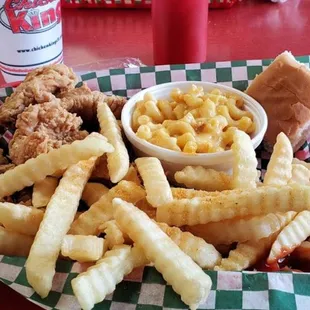 a basket of fries and macaroni and cheese