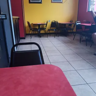 a woman sitting at a table in a restaurant