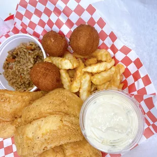 Fried Flounder dinner served with two sides, three hush puppies and tarter sauce