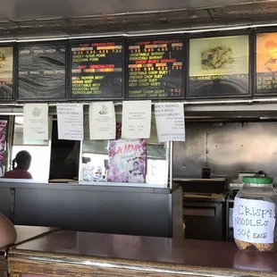 menus on the wall of the restaurant