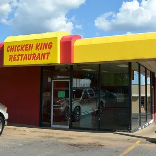 two cars parked in front of the restaurant