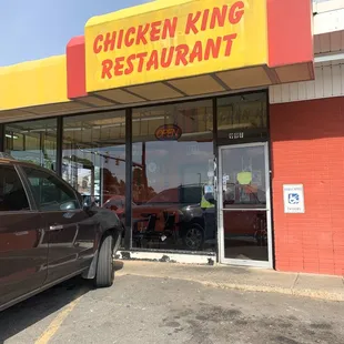 a car parked in front of the restaurant