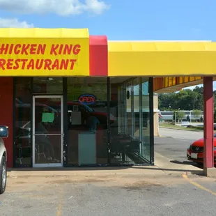 a car parked in front of a restaurant