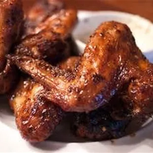 a plate of chicken wings