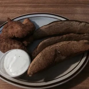 Chicken strips with jo-jos and a side of ranch.