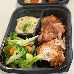 1/2 chicken plate with steamed veggies and hummus