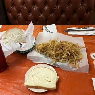 Homemade bread brought table side with butter, small order onion rings, homemade ranch, sweet tea