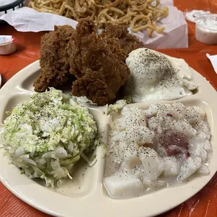 Small onion rings with homemade ranch, dark meat, chicken, thighs, and leg, German potato salad, German slaw, mashed potatoes and milk gravy