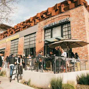 a group of people outside a restaurant