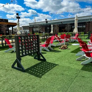  several lawn chairs and tables