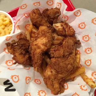 a basket of fries and macaroni and cheese