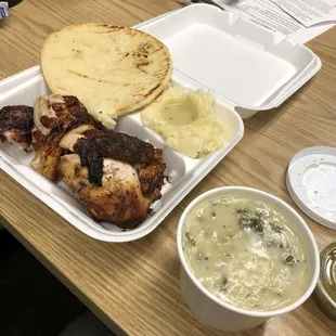 Flame broiled chicken and mashed potatoes and pita bread.