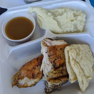 Quarter dark chicken with pita and mashed potatoes with gravy