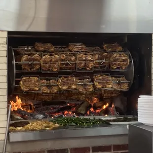 a bunch of chicken on a grill