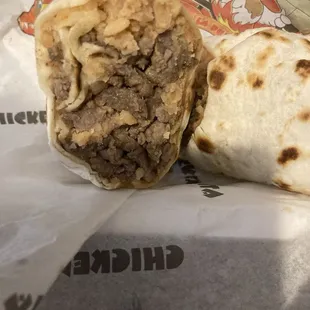 Cross section of their burrito with asada came with beans and a lot of rice! Salad on the side