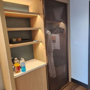 Mini fridge, coffee maker and robes.