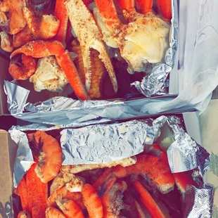 Crab boil- crab, shrimp, potatoes, sausage and corn