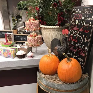 a display of pumpkins on a barrel