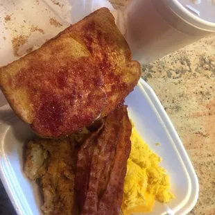 Big Breakfast platter  With bacon, home fries and scrambled eggs and cheese. With butter and jelly toast.