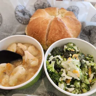 two bowls of soup and a roll