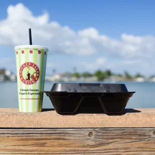 a plastic container with a drink in it
