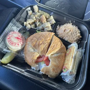 Traditional chicken salad on croissant, pasta salad,