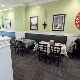 a woman sitting at a table in a restaurant