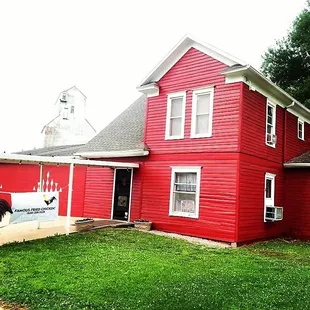 a red house with a white trim