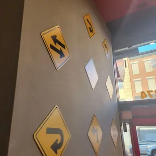 signs on the wall of a restaurant