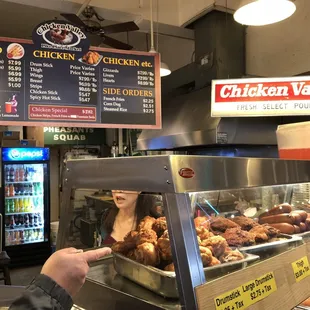 a woman ordering food at the counter