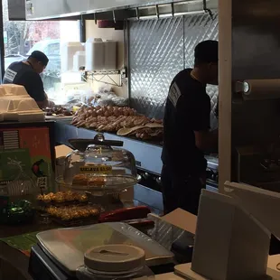 a man and a woman preparing food