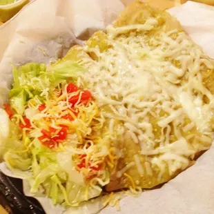a plate of enchiladas and a salad