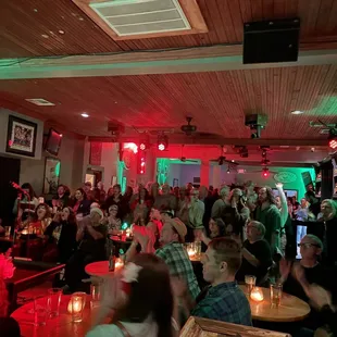 a large group of people in a bar