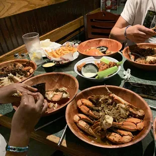 3 orders of blue crab in garlic, Buffalo wings and crab fries with cheese.